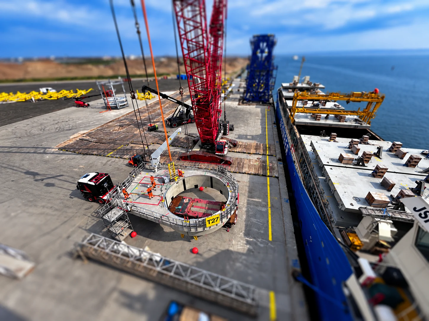 Crane and component handling beside a vessel